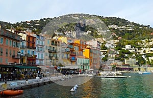 Colorful buildings with traditional architecture near the harbor of Villefranche sur Mer, French Riviera, France