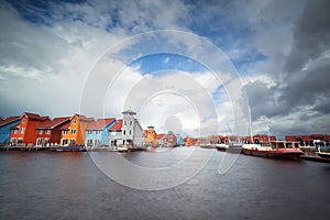 Colorful buildings on water, yach and boats
