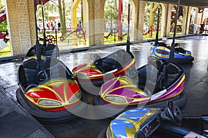 Colorful bumper cars, racing cars in amusement park, racing with bumps