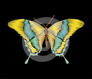 Colorful butterfly in embroidery stitches style on black background