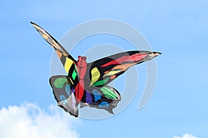 Colorful butterfly kite against a blue sky