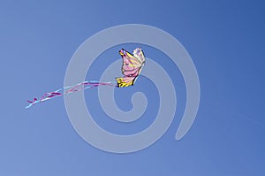 Colorful butterfly kite in blue sky