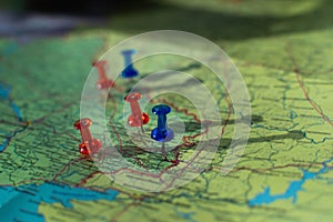 Colorful button nails on map of Ukraine. Strategy plan close up