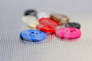 Colorful buttons on metallic background