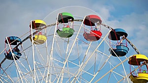 Colorful cabins of ferris wheel close up