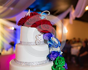 A colorful cake with flowers on a table during an event