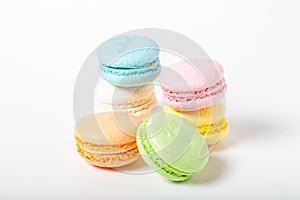 Colorful cake macaroons on a light background