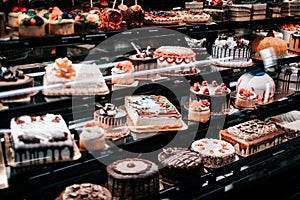 Colorful cakes on shop-window for sale at Safeway american supermarket chain