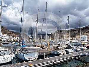 Colorful canarian fishing boats at the harbor in Puerto de Mogan, Gran Canaria, Canary Islands, Spain