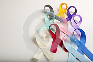 Multi colored cancer ribbons Proudly worn by patients, supporters and survivors for world cancer day. Bringing awareness to all ty photo