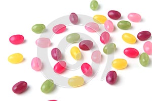 colorful candies jelly beans spread on white background