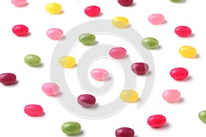 colorful candies jelly beans spread on white background