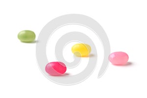 colorful candies jelly beans spread on white background