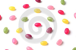 colorful candies jelly beans spread on white background