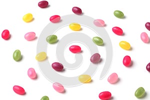 colorful candies jelly beans spread on white background