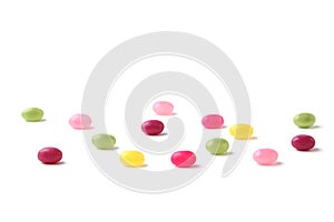 colorful candies jelly beans spread on white background