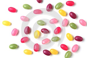 colorful candies jelly beans spread on white background