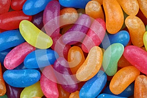 Colorful candy beans as texture and background for design. Close up view of jelly candy beans with selective focus