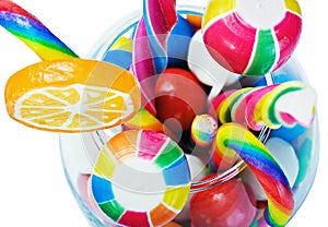 Colorful candy in a glass isolated