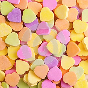 Colorful candy hearts. Background