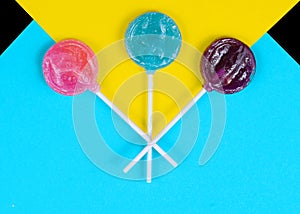 Colorful candy lollipops on a bright background. Pop art style