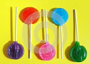 Colorful candy lollipops on a bright background. Pop art style.