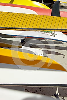 Colorful canoe and windsurf hulls