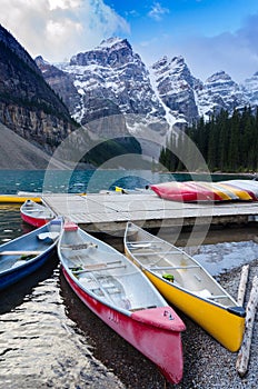 Colorful canoes docked at Moraine Lake