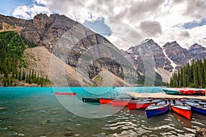 Colorful canoes on Moraine lakel near Lake Louise village in Banff National Park, Alberta, Rocky Mountains Canada