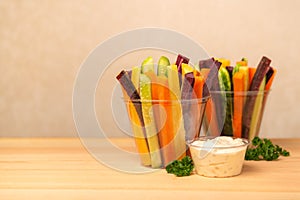 Colorful carrots and cucumbers vegetables julienned in plastic c