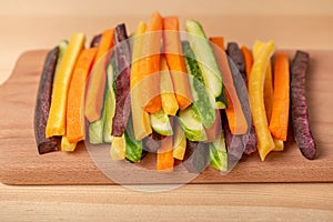 Colorful carrots and cucumbers vegetables julienned for salad on