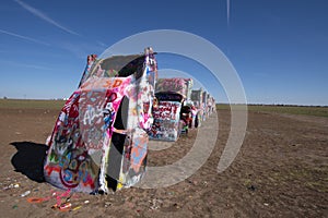 Colourful Cars Buried In The Desert Along Route 66