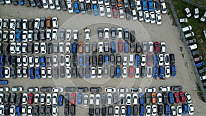Colorful cars in the parking lot of the car market, aerial view