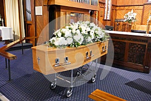 A colorful casket in a hearse or chapel before funeral or burial at cemetery