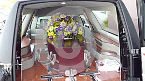 A colorful casket in a hearse or chapel before funeral or burial at cemetery