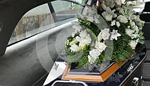 A colorful casket in a hearse or chapel before funeral or burial at cemetery