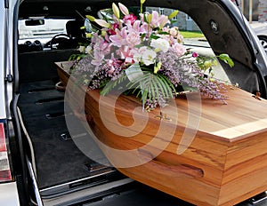 A colorful casket in a hearse or church before funeral