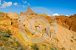 Colorful castle shape mountains, yellow and different color painted hills