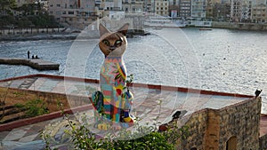 Colorful cat statue in the Independence Garden, Exiles bay, Malta