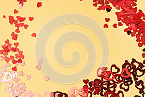 Colorful Celebration Background with Party Confetti in Shape of Heart on Yellow Background Flat Lay Holiday Background Top View