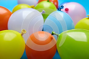 Colorful celebration fun balloons on blue background