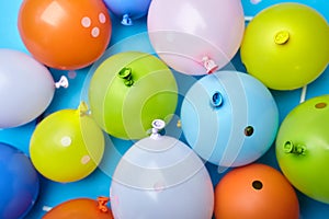 Colorful celebration fun balloons on blue background