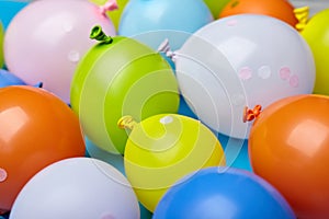 Colorful celebration fun balloons on blue background