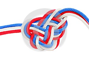Colorful celtic knot made from cords on white