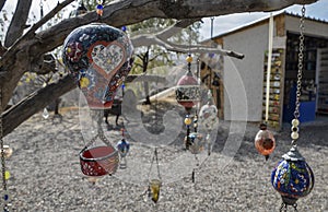 Colorful ceramic hot air balloon gift hanging on a tree. Souvenir from Cappadocia, Goreme, Turkey