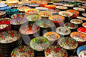 Colorful ceramic plates for sale in Turkey. Decorated tableware in the tourist store. souvenir