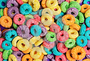 Colorful cereal on a purple background