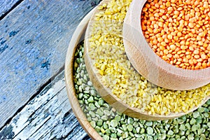 Colorful cereals - red lentils, yellow bulgur and green peas