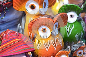 Colorful ceremic owls in an outdoor market. photo