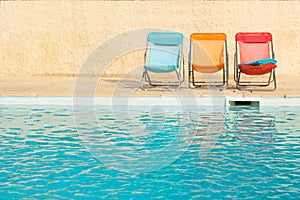 Colorful chairs at swimming pool